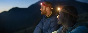 a couple wearing headlamps